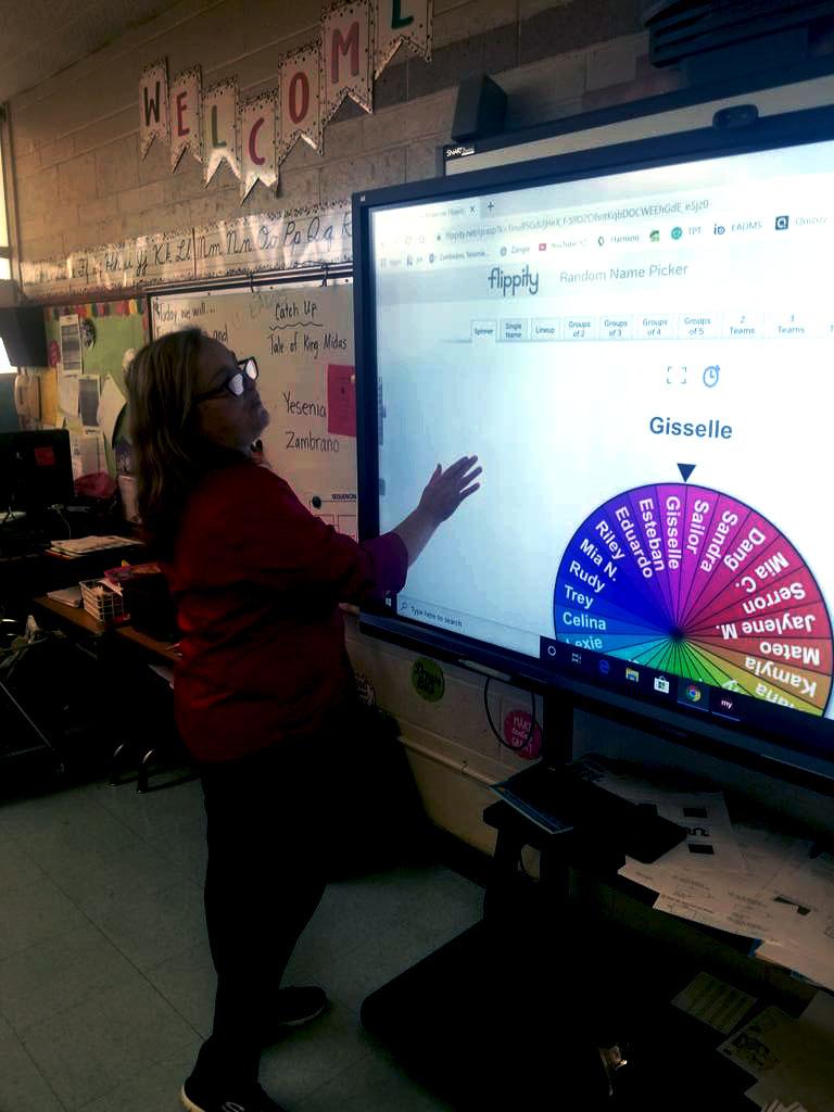Mrs. Zambrano teaching using smart technology